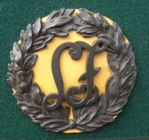2 LF laurel wreath hat badges